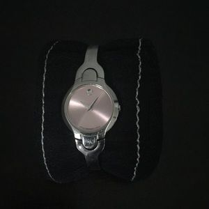 Movado silver womens watch. Diamond on pink face.